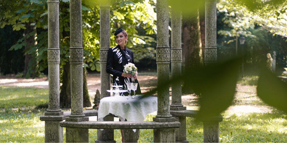 woman wearing a fashionable black and white print dress