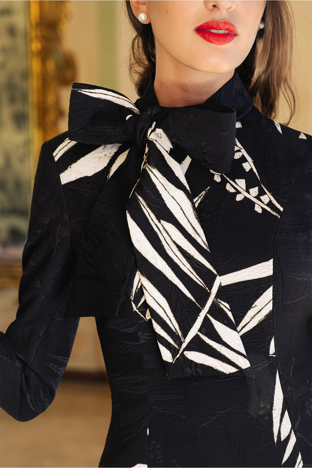 fashionable black and white print dress with a bow